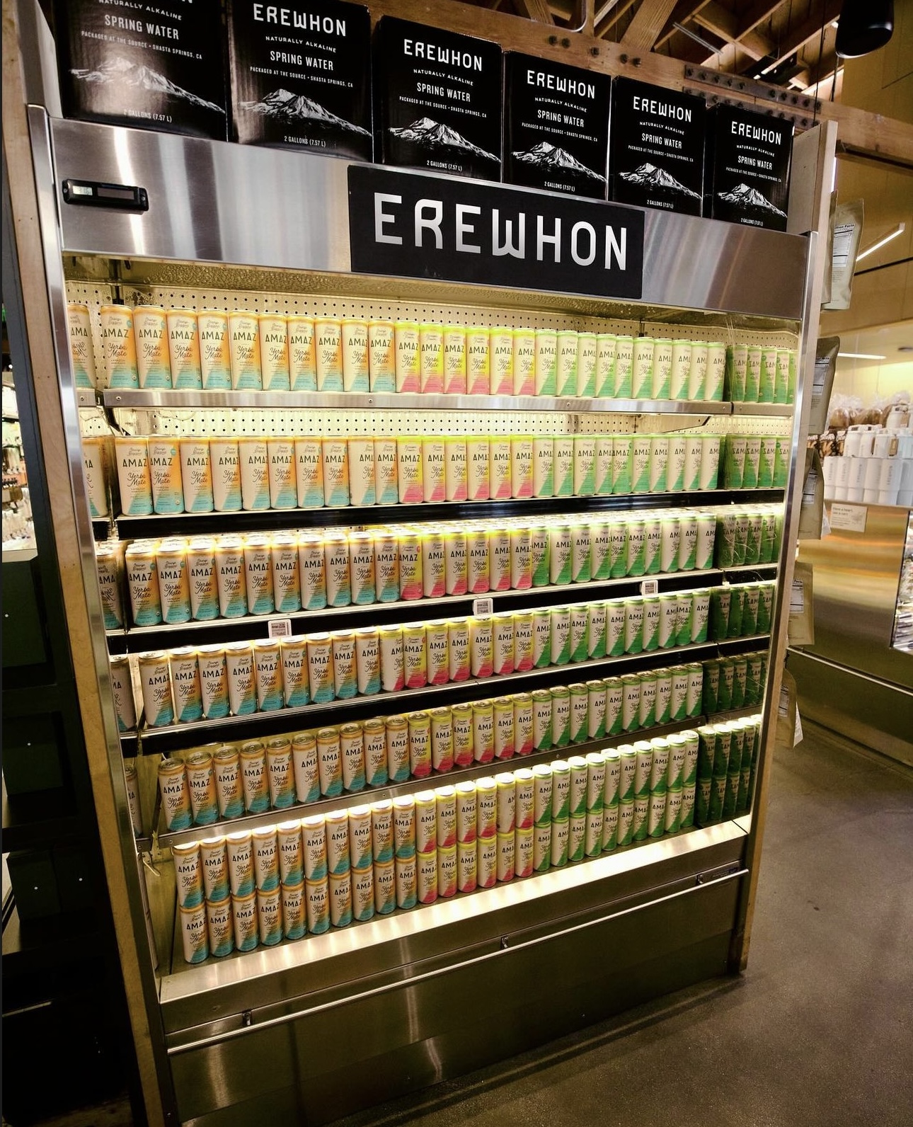 AMAZ full-cooler placement at Erewhon — the shelf every brand fights for.
